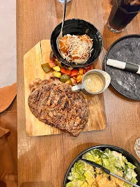 Authentic smoked brisket platter with sliders, coleslaw, and pickles in Edmonton.